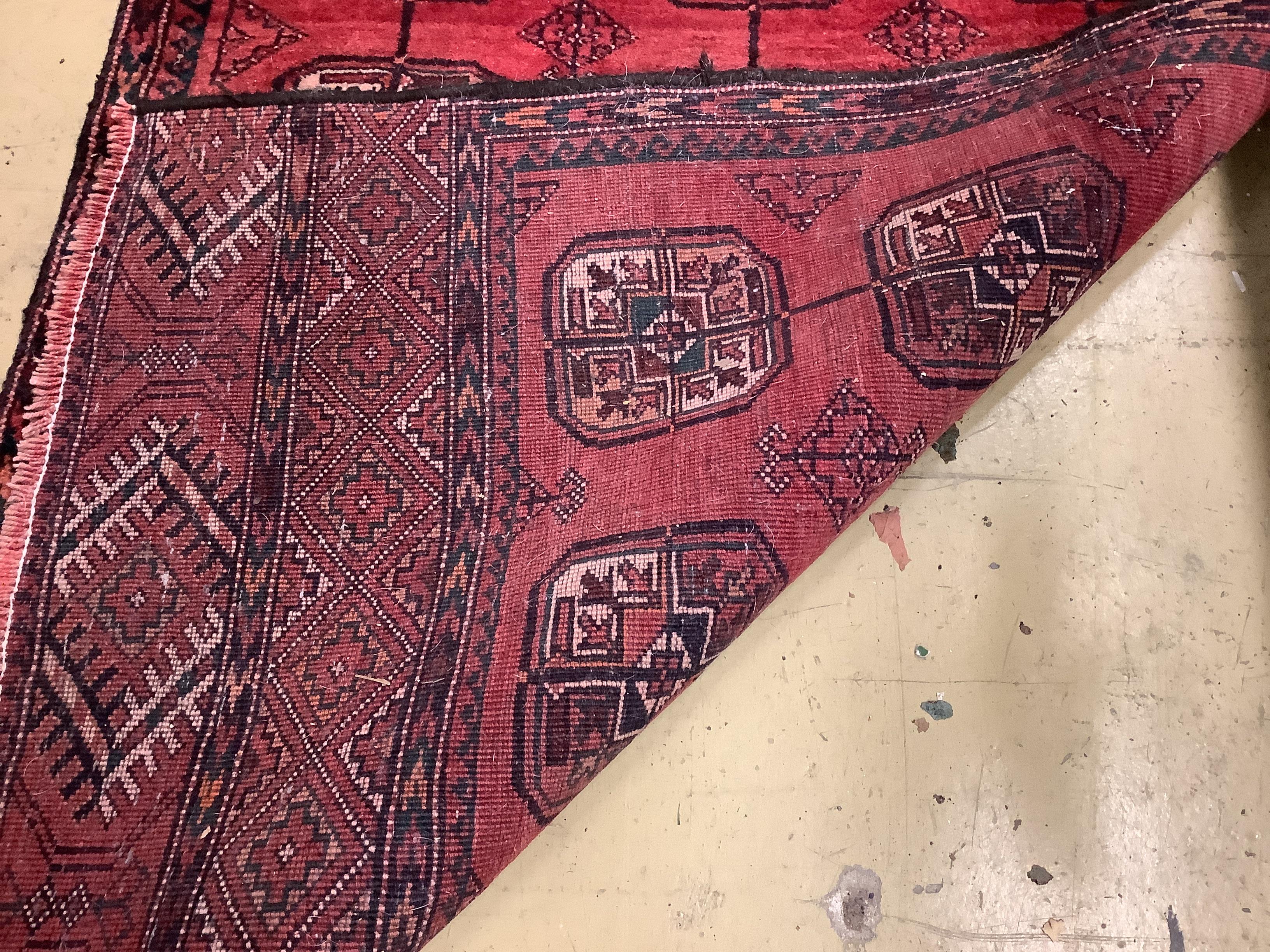 A Bokhara red ground runner, 232 x 80cm